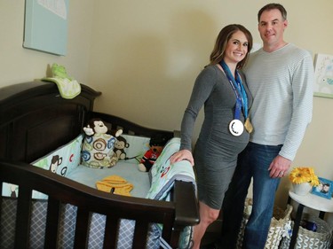Meaghan Mikkelson of Olympic hockey and Amazing Race Canada fame and her husband Scott Reid are launching a campaign to have Canada name their baby. The couple were photographed in their Calgary home.