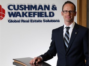 Mike Warner, VP Industrial Sales & Leasing with Cushman & Wakefield was photographed in the company's Calgary offices on Monday July 13, 2015. Gavin Young/Calgary Herald)  (For Business section story by David Parker) Trax# 00066856A