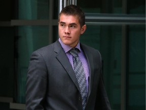 Calgary Flames prospect Micheal Ferland leaves the Calgary Courts Centre during a break in his assault trial on Monday June 9, 2014.