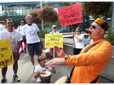 Roger Duncan of the Save The Slopes group plays bongos to inspire his people Sunday July 18, 2015 during a protest at City Hall. The group is trying to stop large development adjacent to Canada Olympic Park on the Paskapoo Slopes.