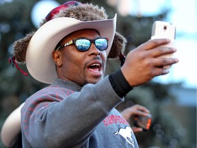 Former Calgary Stampeders receiver Nik Lewis celebrates during the Grey Cup Champions rally at City Hall in Calgary on December 02, 2014.