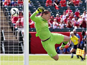 Canada's goalkeeper Erin McLeod makes a save against China during a FIFA Women's World Cup soccer match in Edmonton, Alberta, Canada on June 6, 2015.