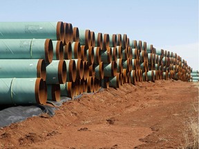 Miles of pipe for the stalled Canada-to-Texas Keystone XL pipeline are stacked in a field near Ripley, Okla.