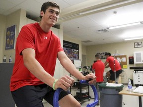 Mason Marchment performs fitness testing on a stationary bike at WinSport on the opening day of Calgary Flames development camp. He's the son of former NHL defenceman Bryan Marchment.