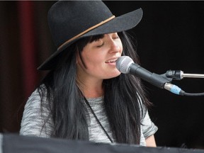 Keyboardist Liz Stevens of Calgary band Copperhead plays to the crowd on Stage 1 at Calgary's Folk Festival held annually at Prince's Island on July 25th, 2015.