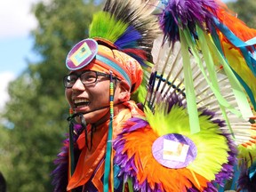 Blake Yellowhorn, a First Nations dancer, performs during a powwow on Prince's Island on Canada Day 2015.