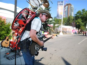 Paul David, known as Bandaloni, performs at the north entrance to Stampede Park on Thursday July 9, 2015.