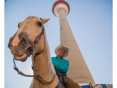 David Cowley prepares to lead his horse an elevator to the observation deck of the Calgary Tower in Calgary on Thursday, July 2, 2015.