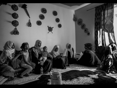 Family and friends of Farida Abdurahman gather in her home in Calgary on July 31, 2015,  to mourn her death. Abdourahman died after being hit by a hit and run driver on Centre St. North on Monday.