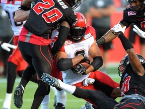 Calgary Stampeders' Jon Cornish makes a touchdown against the Ottawa Redblacks during second quarter CFL football action in Ottawa on Friday, July 24, 2015.