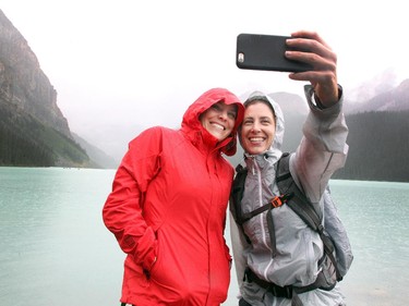 Friends Mindy Hamilton, left, and Maura Hamilton from Austin, TX. stopped to take a selfie photo of themselves on the banks of Lake Louise while visiting on July 23, 2015. Maura is currently on a three week road trip which is including stops in Lake Louise and Jasper.