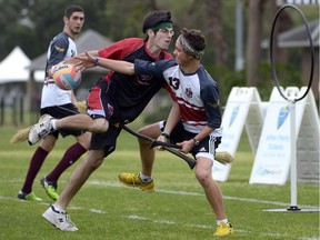 Silicon Valley Skrewts' Logan Anbinder, center, drives to the goal between the University of Ottawa Quidditch team's Matthew Bunn, right, and Ahmed Al-Slaq during a scrimmage at the Quidditch World Cup in Kissimmee, Fla., Friday, April 12, 2013. Quidditch is a game born within the pages of Harry Potter novels, but in recent years it's become a real-life sport. The game is a co-ed, full contact sport that combines elements of rugby, dodgeball and Olympic handball.