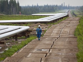 A Nexen Inc. worker is pictured at the companys Long Lake thermal oilsands project in this file image.