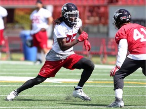 Calgary Stampeders wide receiver Joe West ran down field against Adam Thibault as they practiced at McMahon Stadium on Wednesday.