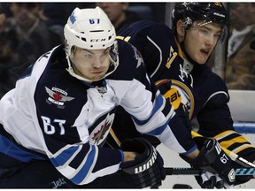 Newest Flame Michael Frolik, a free-agent signing from the Winnipeg Jets, is "a guy that helps you win," says GM Brad Treliving.