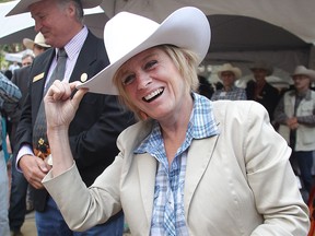 Premier Rachel Notley tips her Stetson after getting white-hatted at the annual Premier's Stampede Pancake Breakfast.