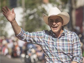 Joe Ceci waves to the crowds at the Calgary Stampede Parade in Calgary on Friday, July 3.