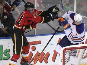 Calgary Flames prospect Hunter Smith slams into Graeme Craig of the Edmonton Oilers during last September's Youngstars Tournament in Penticton, B.C.