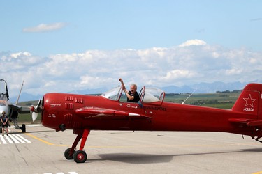 Bud Granley waves to the crowd after performing during the Wings Over Springbank air show at Springbank Airport west of Calgary on July 19, 2015.