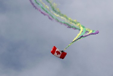 A member of the SkyHawks parachute team makes a jump during the Wings Over Springbank air show at Springbank Airport west of Calgary on July 19, 2015.