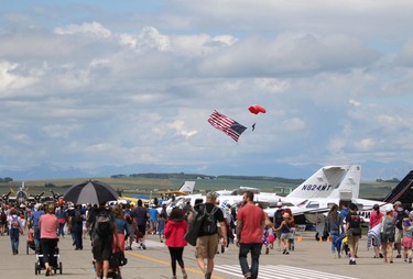 A member of the SkyHawks parachute team makes a jump during the Wings Over Springbank air show at Springbank Airport west of Calgary on July 19, 2015.