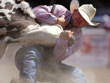 Clayton Moore of Pouce Coupe, BC during the Calgary Stampede Steer Wrestling Championship.