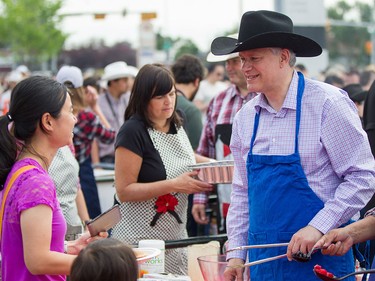 Prime Minister Steven Harper hands out pancakes at the annual Chinook Mall Stampede Breakfast in SW Calgary on July 4th.
