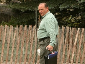 Milowe Brost enters his home in Chestermere, Alberta on September 17.