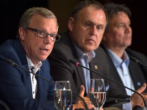 Saskatchewan Premier Brad Wall, left, fields a question as Nunavut Premier Peter Taptuna, right, and Yukon Premier Darrell Pasloski look on at the closing news conference of the summer meeting of Canada's premiers in St. John's on Friday, July 17.