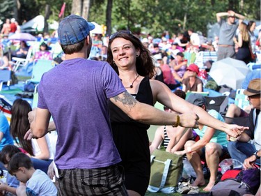 Wes Pouliot and Alicia Young get their groove on in front of the main stage at the Folk Festival in Calgary, on July 24, 2015.