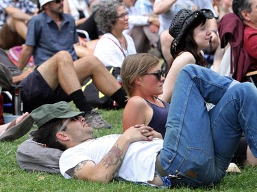 With the heat, David Bowie, no relation to the music star, has a quick rest at the Folk Festival in Calgary, on July 24, 2015.