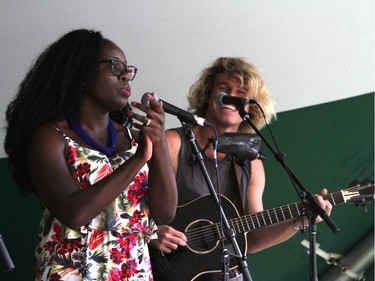 Folk festival goers dance and sway to Blues Swayed Shoes Lynn Olagundoye and Kim Churchill play at the Folk Festival in Calgary, on July 24, 2015.