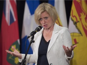 Alberta Premier Rachel Notley fields questions at the summer meeting of Canada's premiers in St. John's last Thursday. Reader says consumers, not producers, should pay a carbon tax.