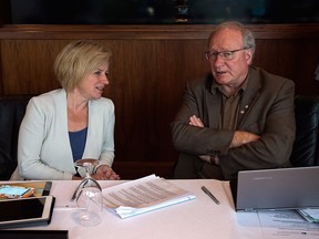 lberta Premier Rachel Notley, left, and Prince Edward Island Premier Wade MacLauchlan talk during the summer meeting of Canada's premiers in St. John's on Friday, July 17, 2015.