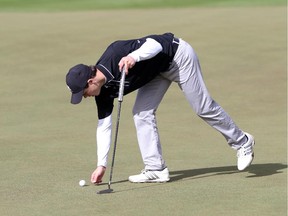 Carter Lewis marks his ball during the ATB Classic qualifying at Blue Devil Golf Club on Monday.