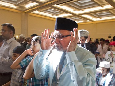 Sultan Mahmood prays during  the Eid ceremony, marking the end of the holy month of Ramadan, Saturday July 17, 2015 at Baitun Nur Mosque mosque. Muslims attend the congregational Eid prayer service the morning after the end of Ramadan.