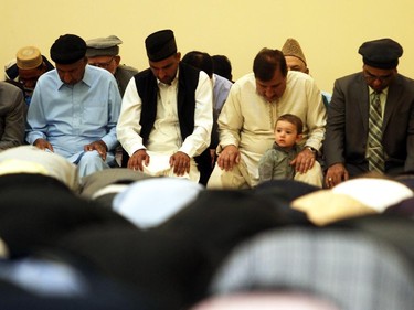 Muslims pray durig the Eid ceremony, marking the end of the holy month of Ramadan, Saturday July 17, 2015 at Baitun Nur Mosque mosque. Muslims attend the congregational Eid prayer service the morning after the end of Ramadan.