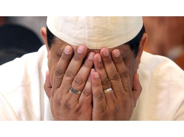 A Muslim man  prays during the Eid ceremony, marking the end of the holy month of Ramadan, Saturday July 18, 2015 at Baitun Nur Mosque mosque. Muslims attend the congregational Eid prayer service the morning after the end of Ramadan.