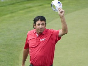 Billy Andrade tips his hat to the gallery after tapping in his eagle putt on the 18th green during regulation play in the final round of the Shaw Charity Classic at the Canyon Meadows Golf & Country Club  on August 31, 2014 in Calgary, Canada.