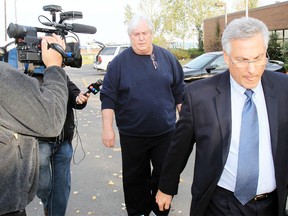Gary Sorenson leaves the Airdrie RCMP detachment after turning himself in and being released on bail on Tuesday, September 29, 2009.