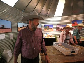 Federal NDP leader Tom Mulcair tours the Agricultural building at the Calgary Stampede in Calgary, on July 4, 2015.