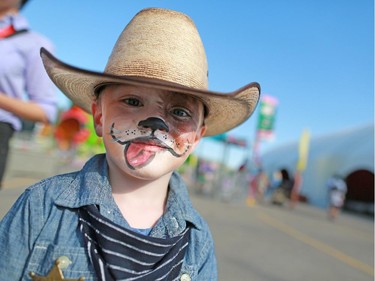 Four year-old Noah Adam's favourite time of the year is Stampede. He was having fun in the Great Funtier Kids Zone at Sneak-a-Peek on Thursday July 2, 2015.