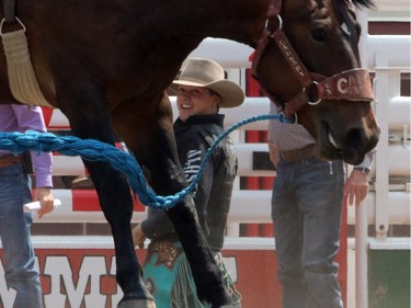 Lane Cust from Ardmore, Alberta wins his round on Y So Dusty during the novice saddle bronc bareback championship at the Calgary Stampede in Calgary, on July 7, 2015.