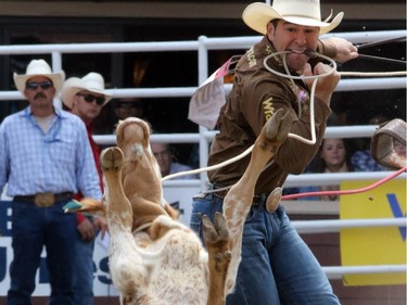 Morgan Grant from Granton, Ontario received a no time  after flipping his calf on to its back at the tie-down roping championship at the Calgary Stampede in Calgary, on July 7, 2015.