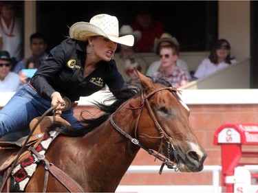 Samantha Lyne from Texas rides her horse that has one eye, during the barrel racing championship at the Calgary Stampede in Calgary, on July 7, 2015.