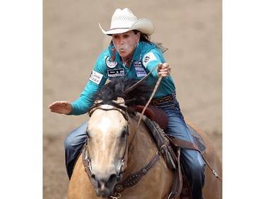 Lisa Lockhart of Oelrichs, South Dakota rides to victory on the day in Barrel Racing at the Calgary Stampede Rodeo Wednesday July 9, 2015. (Ted Rhodes/Calgary Herald) For Stampede story by Kristen Odland. Trax # 00066087F