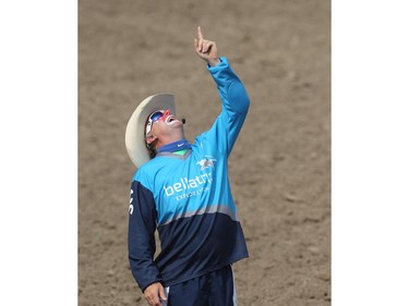 Rodeo clown Clint Rasmussen points skywards to the drone being used by the Calgary Stampede Rodeo Wednesday July 9, 2015.