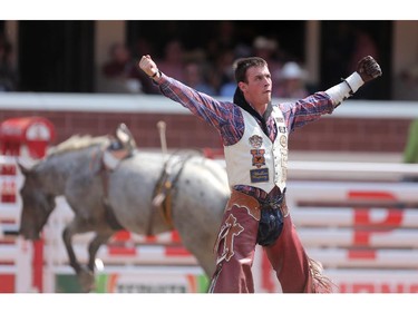 CALGARY.;  July 10, 2015, 2015  -- Tim O'Connell celebrates his ride on Up In Smoke during the Calgary Stampede Bareback Championship. Photo Leah Hennel/Calgary Herald