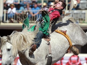 Clint  Laye of Cadogan, Alta.  earned $100,000 on a horse called Virgil with a score of 88.00 in the bareback riding event at the Stampede finals on Sunday.