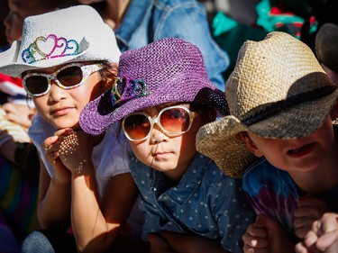 Young spectators take in the Calgary Stampede parade in Calgary, Friday, July 3.